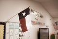 Texas and American flags proudly display in pre-kindergarten classroom near Dallas, modern preschooler class furniture, bulletin