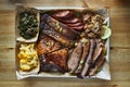 Texas bbq style tray with smoked beef brisket, st louis ribs, chicken and hot links