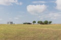 Texas farm house with large storage tower silo in farmyard prairie Royalty Free Stock Photo