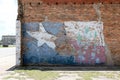 Texas flag mural on red brick wall outside business Royalty Free Stock Photo