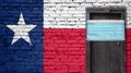 Texas flag painted on brick wall and closed door with medical mask protected Royalty Free Stock Photo