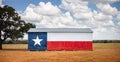 Texas flag painted on old barn. American farmers background, rural scene