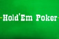 Texas Hold em lettering on the green baize of the poker table Royalty Free Stock Photo