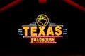 Texas Roadhouse Restaurant Exterior and Trademark Logo at Night