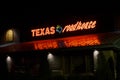 Texas Roadhouse Restaurant Exterior and Trademark Logo at Night