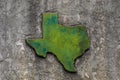 Texas shaped grunge rough textured concrete decoration on stone wall