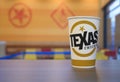 Texas soft drink cup on wooden table