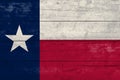 Texas State flag on a wooden surface. Banner of the grunge Texas State flag Royalty Free Stock Photo