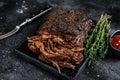 Texas Style BBQ Smoked Beef Brisket meat steak. Black background. Top view Royalty Free Stock Photo