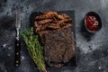 Texas Style BBQ Smoked Beef Brisket meat steak. Black background. Top view Royalty Free Stock Photo