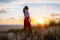 Texel lighthouse during sunset Netherlands Dutch Island Texel, girl visit the lighthouse , woman on vacation Texel Royalty Free Stock Photo