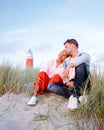 Texel lighthouse during sunset Netherlands Dutch Island Texel, couple visit the lighthouse , men and woman on vacation Royalty Free Stock Photo