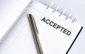 Text ACCEPTED on the short note texture background with pen Royalty Free Stock Photo
