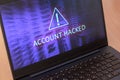 Text account hacked on laptop screen. Royalty Free Stock Photo