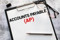 text Accounts Payable - AP on white paper, concept