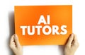 Text AI TUTORS on card held by hands, representing artificial intelligence in education, online teaching, smart learning systems, Royalty Free Stock Photo