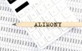 Text ALIMONY on the wooden pencil on calculator with chart Royalty Free Stock Photo