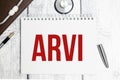 Text ARVI on a white background with stethoscope Royalty Free Stock Photo