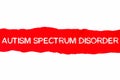 Text AUTISM SPECTRUM DISORDER appearing behind red torn paper Royalty Free Stock Photo
