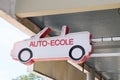 Text auto-ecole french means driving school in car signage in france on building facade
