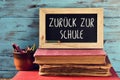 Text back to school in German in a chalkboard Royalty Free Stock Photo