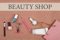 Text Beaury shop and striped gift bag with cosmetics set for make-up Royalty Free Stock Photo