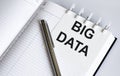 Text BIG DATA on the short note texture background with pen Royalty Free Stock Photo