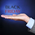 Text black friday in the hand of a businessman