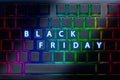 Text black friday on the neon keyboard