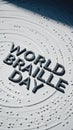 Text in Braille reading \'World Braille Day\' on a textured surface. The design emphasizes accessibility Royalty Free Stock Photo