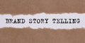 Text BRAND STORY TRLLING appearing behind ripped brown paper