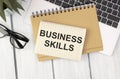 Text BUSINESS SKILLS written on white paper