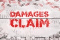 Text caption presenting Damages Claim. Word Written on Demand Compensation Litigate Insurance File Suit