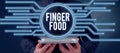 Text caption presenting Finger Food. Internet Concept products and digestives that is to be held with the fingers for