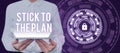 Text caption presenting Stick To The PlanTo adhere to some plan and not deviate from it Follow. Word for To adhere to Royalty Free Stock Photo