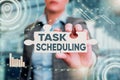 Text caption presenting Task Scheduling. Internet Concept The assignment of start and end times to a set of tasks