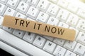 Hand writing sign Try It Now. Concept meaning Free trial of something new experiment different things -48592