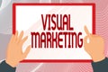 Text caption presenting Visual Marketing. Conceptual photo telling the story of your brand or product by creation Hands