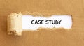 Text Case Study appearing behind torn brown paper Royalty Free Stock Photo