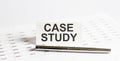 Text CASE STUDY on stickers,pen on the background of documents. Financial bookkeeping, Accounting Concept. Top view Royalty Free Stock Photo