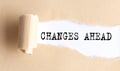 The text CHANGES AHEAD appears on torn paper on white background Royalty Free Stock Photo