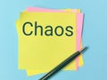 Text CHAOS written on sticky note. Royalty Free Stock Photo