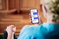 Text or chat messages in phone. Elder senior mature woman sms texting with friend or family. Old lady with cellphone messaging. Royalty Free Stock Photo