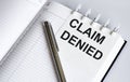 text Claim Denied on the short note texture background with pen Royalty Free Stock Photo