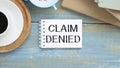 Claim Denied on short note texture background with pen Royalty Free Stock Photo