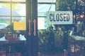 Text Closed door sign and hanging up on glass door