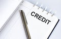 Text CREDIT on the short note texture background with pen Royalty Free Stock Photo