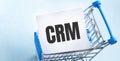 Text crm on the notepad in the shopping cart Royalty Free Stock Photo
