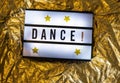 Text Dance on white illuminated board. Conceptual message for entertainment Royalty Free Stock Photo