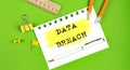 Text DATA BREACH sign showing on gren background with office tools Royalty Free Stock Photo